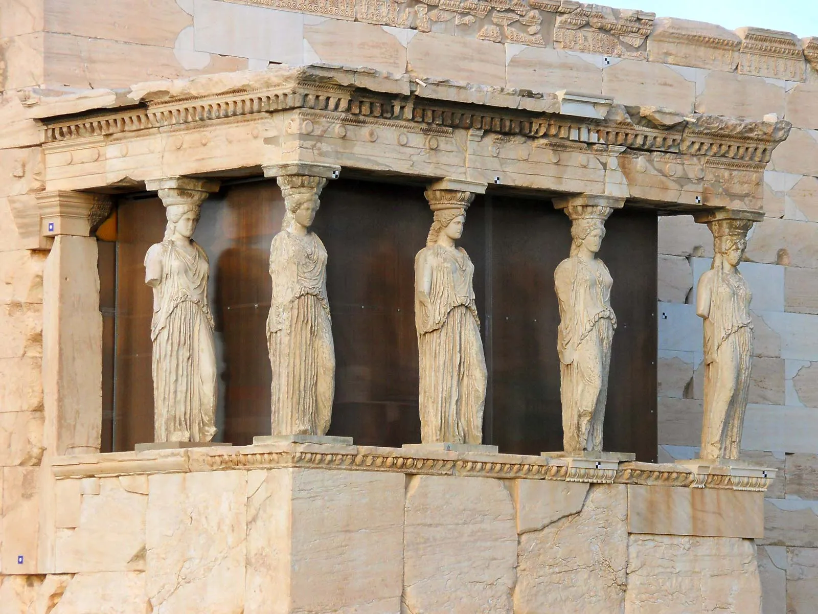 The caryatid figures of the Erechtheion supporting a classical stone porch